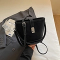 Minimalist black bucket bag with contrast white stitching and silver twist lock - Black without Pendant