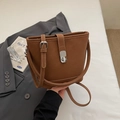 Minimalist dark brown leather bucket bag with silver twist lock and white stitching - Brown No Pendant
