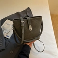 Minimalist bucket bag in dark grey pebble leather with adjustable strap on white bedding - Grey Without Pendant