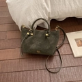 Borsa a secchiello retrò verde oliva scuro con dettagli intrecciati e hardware dorato - Verde