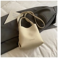 Beige lychee leather bucket bag with top handles and shoulder strap by BABUMAO - Rice White (No Pendant)