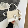 Stylish white leather and beige herringbone crossbody bag with heart tassel accessory - White