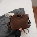 Dark brown leopard print suede crossbody bag with decorative side tassels and top handle - Brown