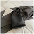 Chic black litchi grain leather bucket bag with brand embossing and slim shoulder strap - Black without Pendant