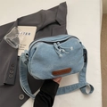 Minimalist light blue denim crossbody bag with leather logo patch and adjustable strap - Light Blue