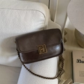 Detail of vintage dark brown faux leather bag with a glossy finish and gold metal buckle - Retro Small Square Bag / Coffee (PU Glossy)