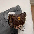 Deep brown quilted crossbody bag with gold twist lock and metallic chain detail - Brown