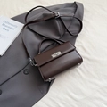 Deep brown vintage leather handbag with silver twist lock and crossbody strap - Brown