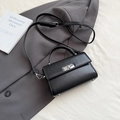 Classic black rectangular handbag with silver rotating buckle and adjustable strap - Black