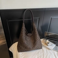 Große Shopper-Tasche mit Leopardenmuster und braunen Lederriemen an strukturierter Wand - Kaffee Kleiner Leopardenmuster