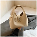 Bolso bombonera minimalista de cuero beige con cierre de giro plateado y asa circular - Blanco