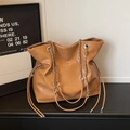 Detail of vintage brown tote bag featuring silver metal chain and soft drawstring texture - Khaki