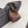 Brown lychee-textured bucket bag with silver twist lock and adjustable shoulder strap - Brown No Pendant
