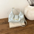 Detailed view of the mint green pleated leather bag with a gold crescent moon ornament - Haze Blue