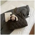 Close-up of quilted charcoal tote bag with golden chain and plush bunny pendant - With Charm / Brown