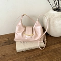 Detail of vintage oil wax leather bag featuring a gold crescent buckle and soft texture - Pink