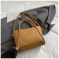 Detail of soft brown PU leather bucket bag on grey suit with an adjustable shoulder strap - Standard Type / Brown