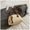 Vintage off-white PU leather bowling bag with brown handles and wood bead charm accessory - Off White