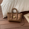 Detail of brown litchi pattern leather bag with golden circular twist lock buckle - Brown