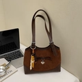 Detail of vintage leopard shoulder bag showing side wooden beads and heart-shaped pendant - Brown with Pendant