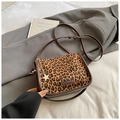 Detail of leopard print shoulder bag with gold star charm and brand leather label - Leopard Coffee With Charm