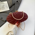 Elegant burgundy oval evening clutch with pleated texture and gold chain strap - Red