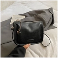 Minimalist black litchi texture crossbody bag with silver star charm and metallic zipper - Black With Pendant