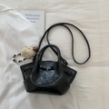 Close-up of black pleated crossbody bag with cute plush puppy charm and beaded strap decor - Black With Pendant