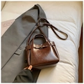 Deep brown vintage style bucket bag in glossy oil wax leather with adjustable strap - Brown No Pendant