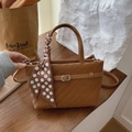 Brown woven crossbody bag with silk scarf detail and vintage metal buckle closure - Brown