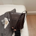 Minimalist dark brown leather bucket bag with adjustable strap and golden hardware - Coffee without Pendant