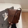 Minimalist dark brown glossy PU leather bucket bag with golden lettering and strap - Brown No Pendant