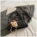 Elegant black glossy bowling bag with a cute bear charm and a beaded handle for women - With Charm Style / Black with Pendant