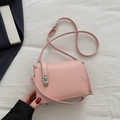 Minimalist light pink crossbody bag with pebbled leather texture and silver clasp - Pink