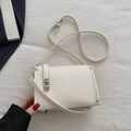 Minimalist creamy white square crossbody bag in litchi textured leather with silver buckle - White