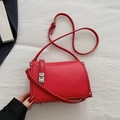 Minimalist red pebble leather square crossbody bag with silver rotating lock detail - Red