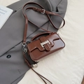 Minimalist deep brown patent leather crossbody bag with silver buckle and heart charm - Brown with Pendant
