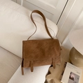 Retro brown textured leather crossbody bag in a cozy indoor lifestyle setting - No Pendant / Brown