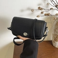 Minimalist black lychee texture leather underarm bag with silver turn-lock and shoulder strap - Black