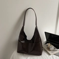 Detailed view of dark brown faux suede tote bag with front pockets on a minimalist desk - Coffee No Charm