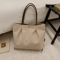 Detail of off-white canvas tote bag with pleated design and brown leather handles - Beige Grey