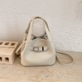 Chic off-white litchi grain leather bucket bag with dual handles and long shoulder strap - White Without Pendant