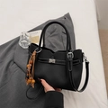 Minimalist black tote bag with white stitching, silver hardware and vintage wood bead charm - Black with Pendant