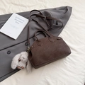 Dark brown retro shell bag in litchi grain faux leather with a cute plush rabbit charm - With Charm / Brown