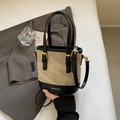 Elegant beige bucket bag with black leather trim and golden buckle detailing - No Pendant / Off-white