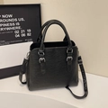 Classic black leather crossbody tote with pebbled texture and silver buckles for women - Black