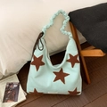 Detail of mint green tote bag with brown plush stars and ruched handle design - Mint Green