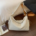 Detail of beige nylon crossbody bag featuring double front zippers and drawstring closure - Off-white