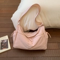 Detail of light pink nylon crossbody bag with side drawstring and wide adjustable strap - Light Pink