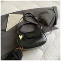 Minimalist black crescent hobo bag with glossy finish and gold heart charm - Black